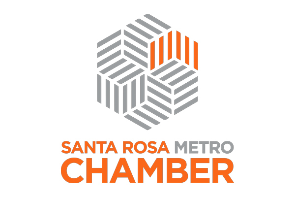 Logo of the Santa Rosa Metro Chamber featuring a geometric hexagon design in gray and orange, with the organization's name in orange and gray text below.