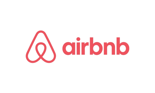 The Airbnb logo features a red abstract symbol next to the word "airbnb" in lowercase red letters on a white background.